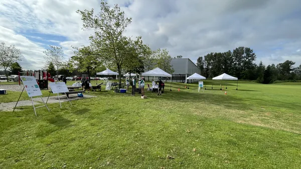 10x10 popup tent rentals at a community event on a grass field