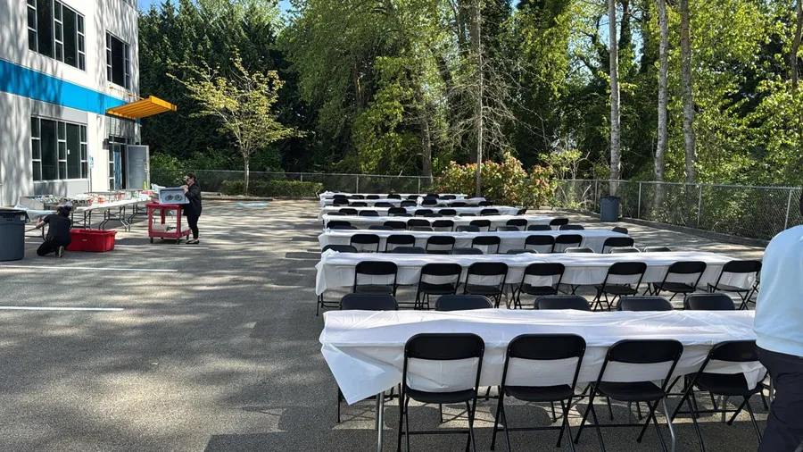 Banquet tables with white linens set for an event