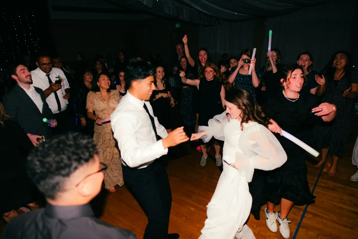 Two people dancing at a wedding reception